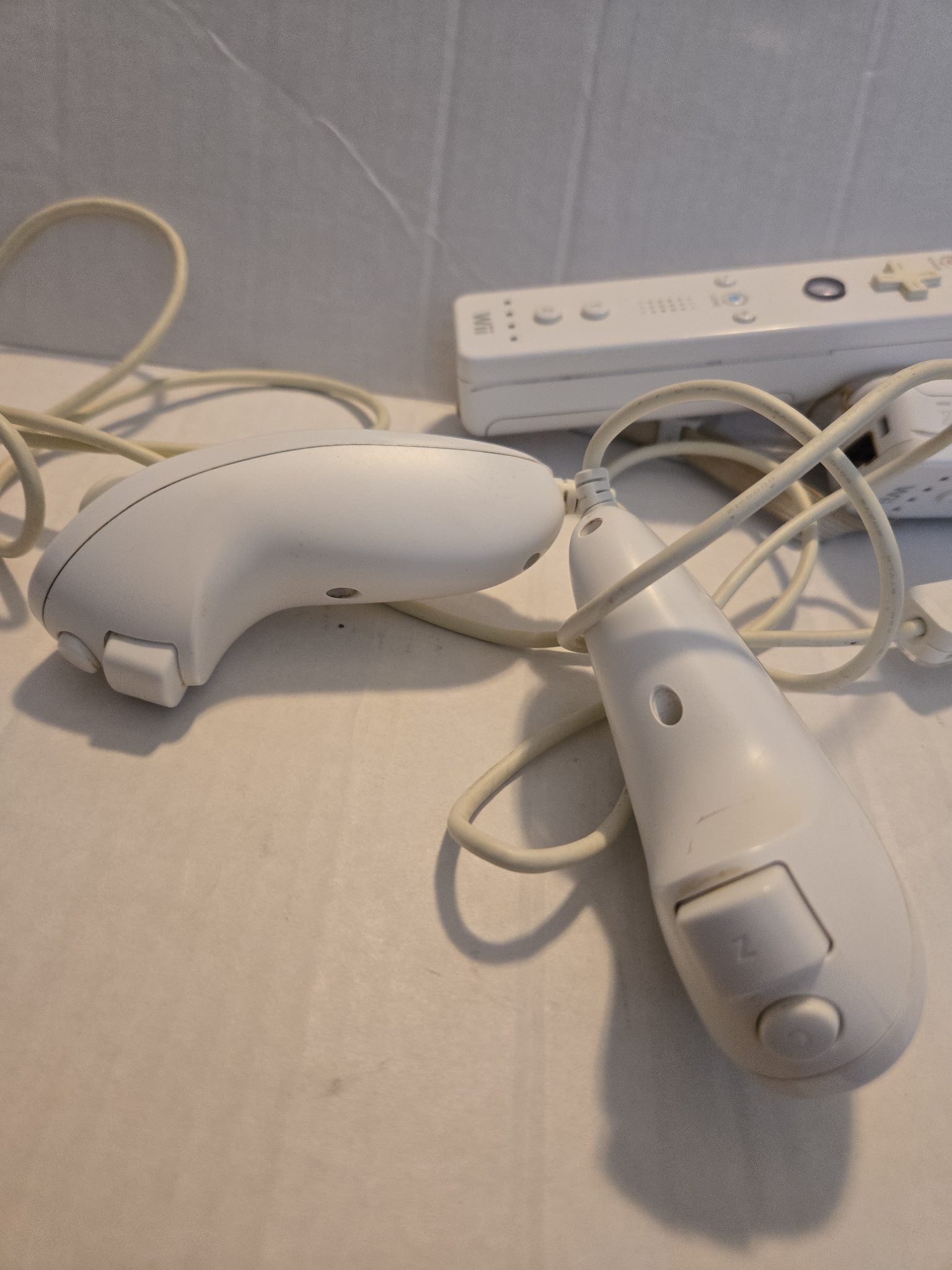 Pair Of Nintendo Wii Remotes With Nunchucks