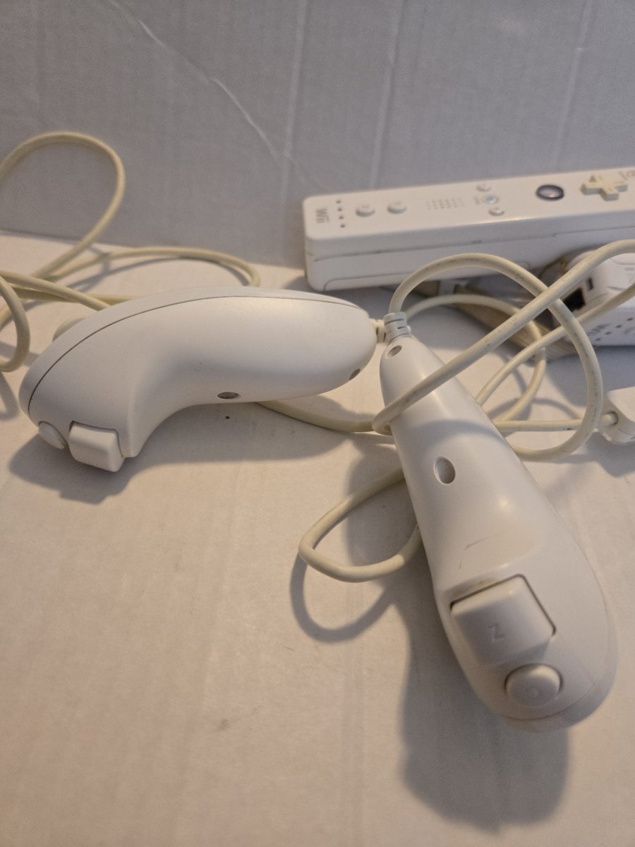 Pair Of Nintendo Wii Remotes With Nunchucks - Video Game Accessories - ThrowbackBuys -Amanda's Awesome Finds